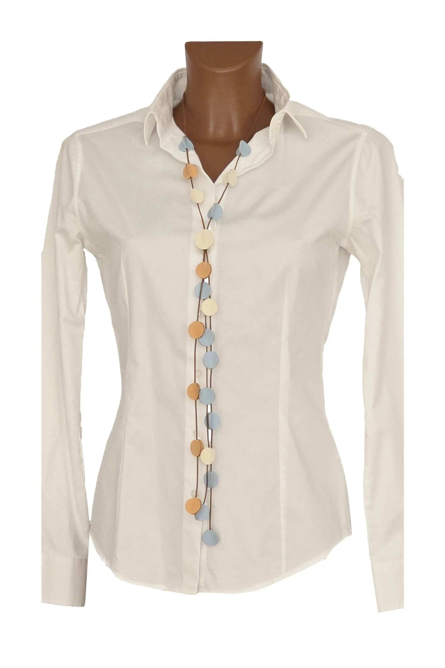 Collana 3D Clear Light handmade adjustable necklace in ivory, ochre, and sky colors on a white shirt