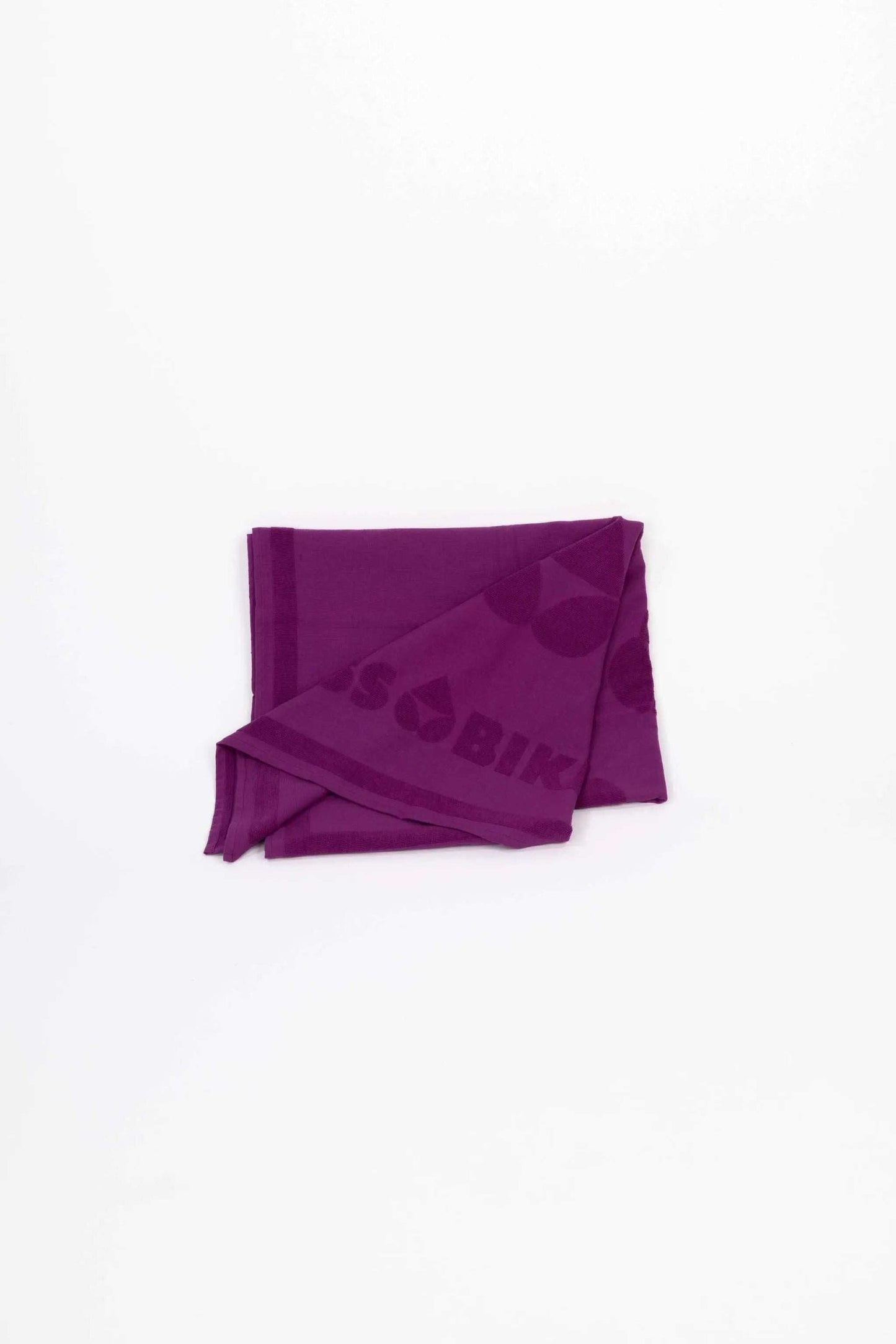 Purple monocolor telo spugna towel with logo detail folded on white background
