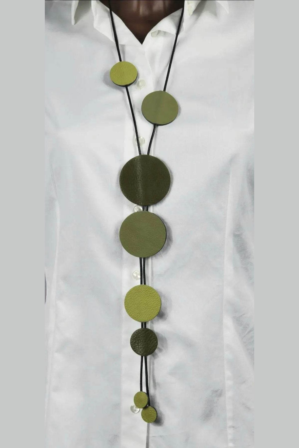 Buble Green handmade lightweight necklace with lime, forest, and sage green leather circles on waxed cord