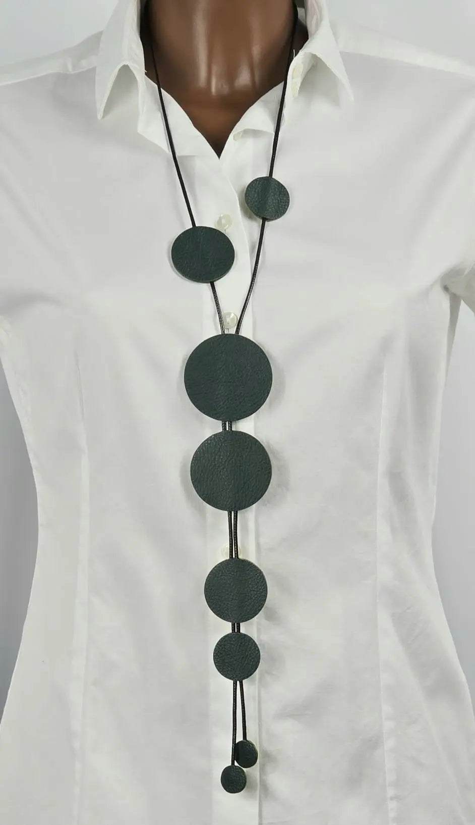 Buble petrolium handmade petroleum green leather bubble necklace on mannequin with white shirt