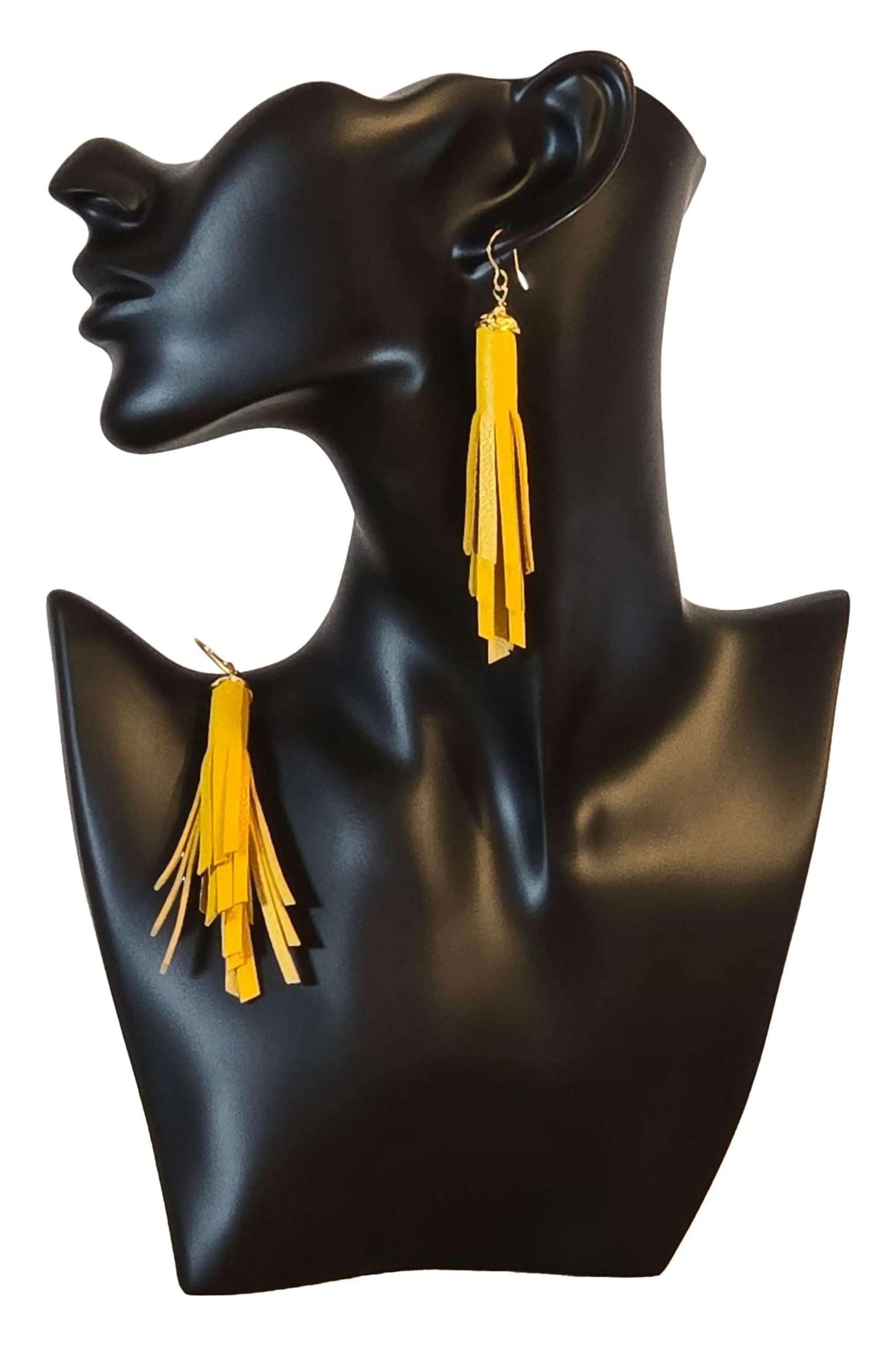 Orecchini Nappa Ocher handmade leather tassel earrings on black mannequin bust