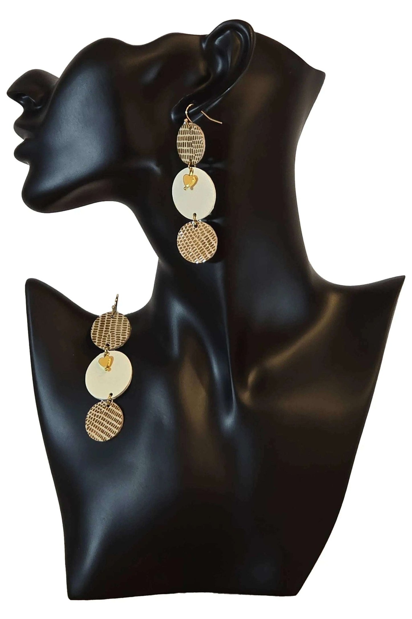 Lightweight handmade Orecchino Honeycomb earrings with agate and genuine leather details on a black mannequin bust