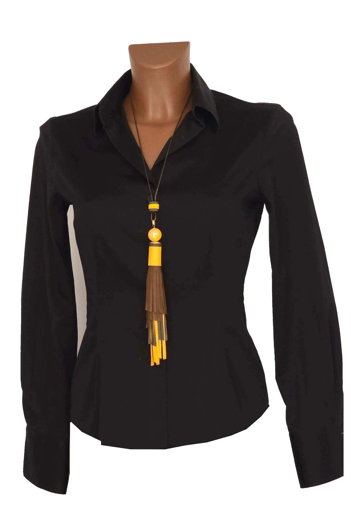 Collana Nappa Jewel necklace with adjustable length, handmade leather and ceramic tassel in ochre, leather and sage colors worn on black shirt