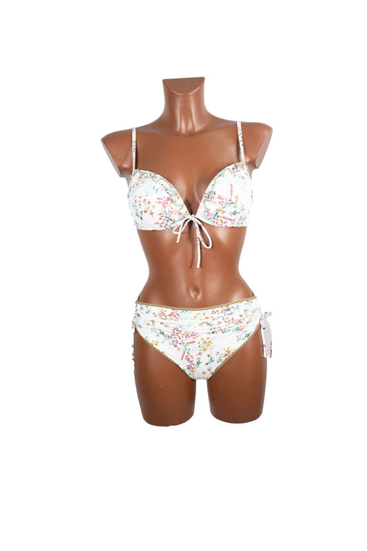 Bikini push up bianco con stampa floreale su manichino marrone