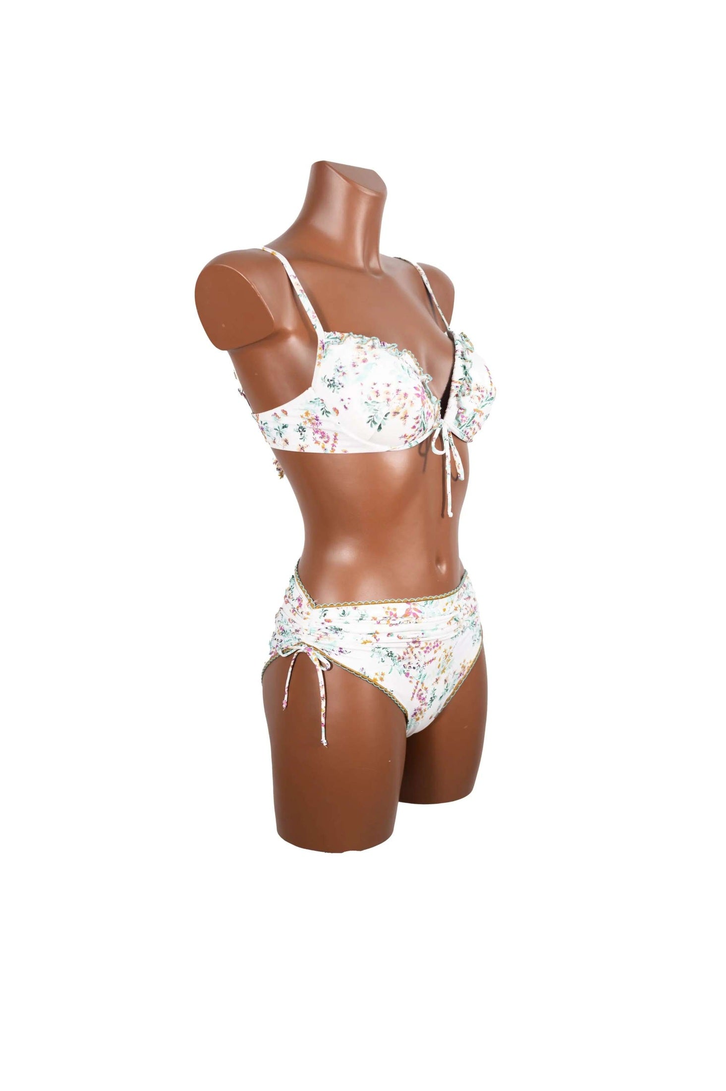 Bikini push up donna bianco con fiori colorati su mannequin marrone