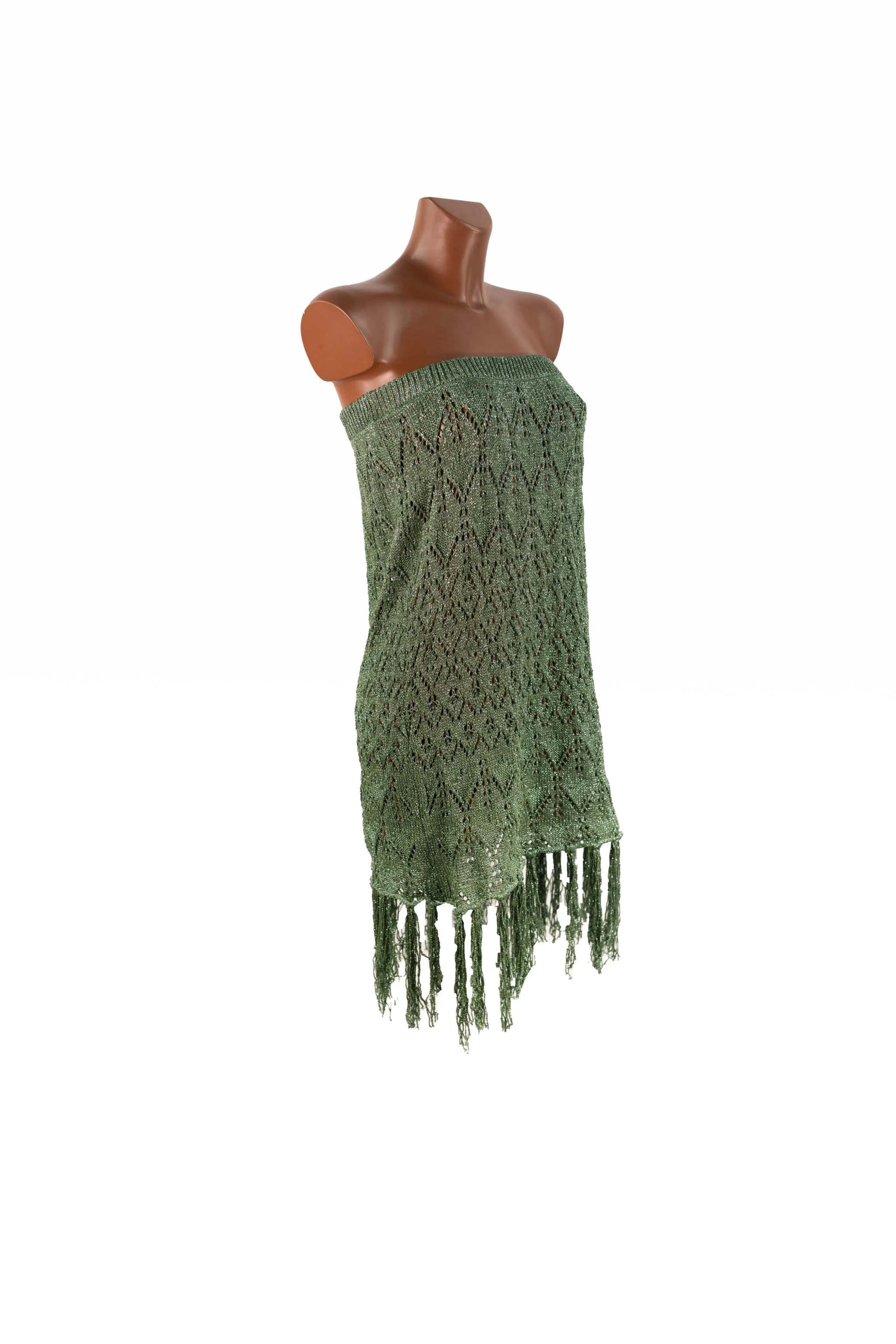 Green lurex knit gown with viscose fabric and fringed hem on mannequin