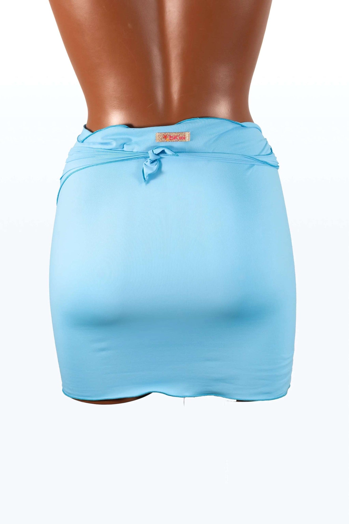 Light blue mini pareo in lycra made in Italy, shown from the back on a model
