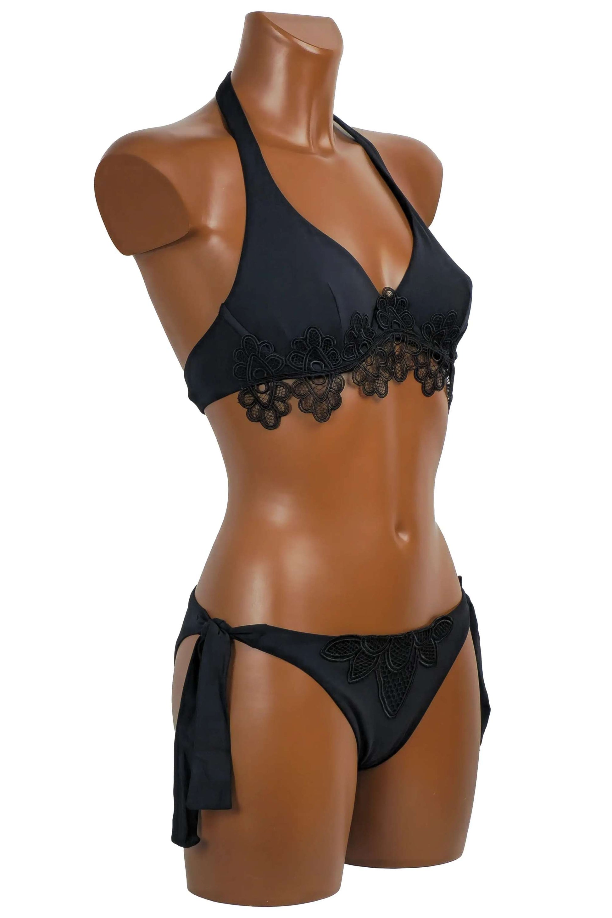 Black bikini ferretto with macrame detail and adjustable side ties on mannequin